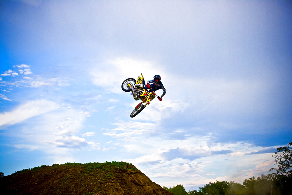 A motocross biker performs a whip during a jump in Brainerd, Minnesota.