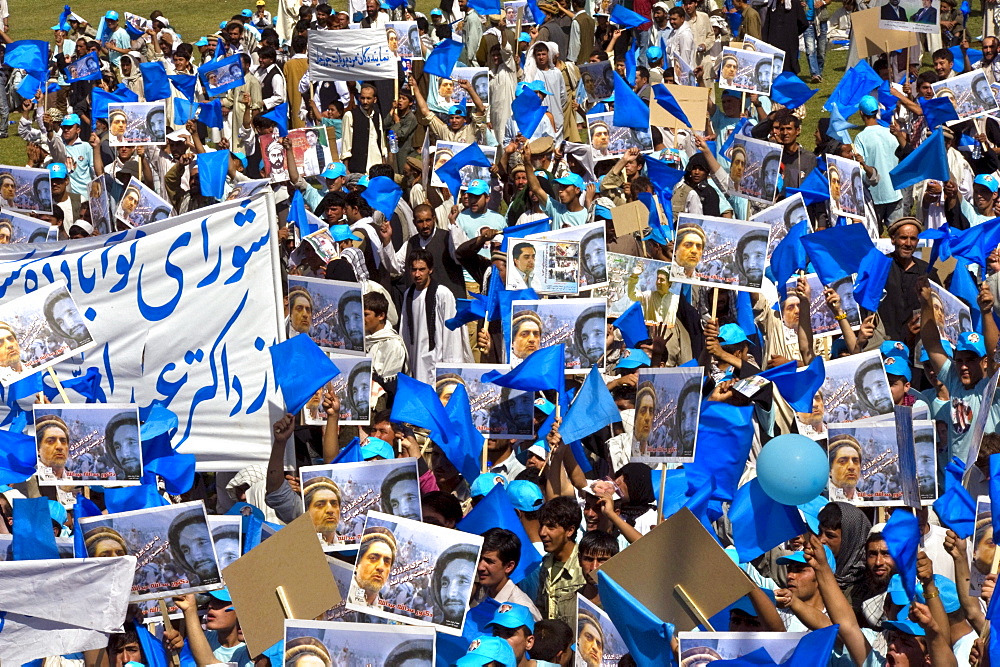 On the last day of campaigning before the election, crowds gather in the National Stadium for a large rally for a favored presidential candidate, Kabul, Afghanistan.