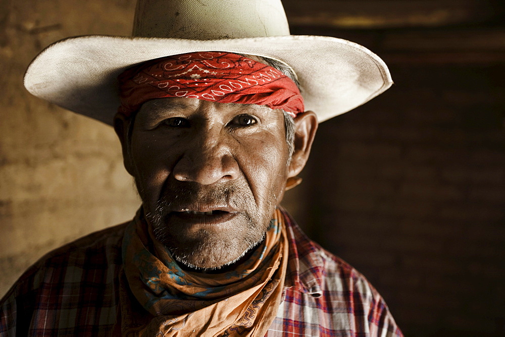 Portrait of a Tarahumara old man inside his house at Guachochi, Chihuahua, Mexico.