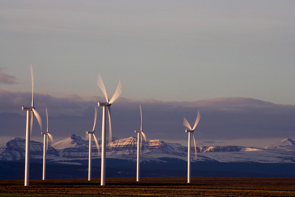 Wind turbines and the High Uinta Mountains at a wind farm in Southern Wyoming.