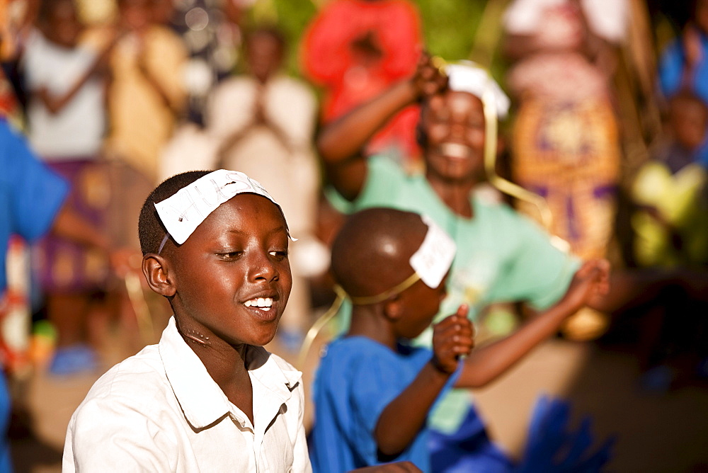 Village girls dancing to welcome an artist and activist back to Rugerero.