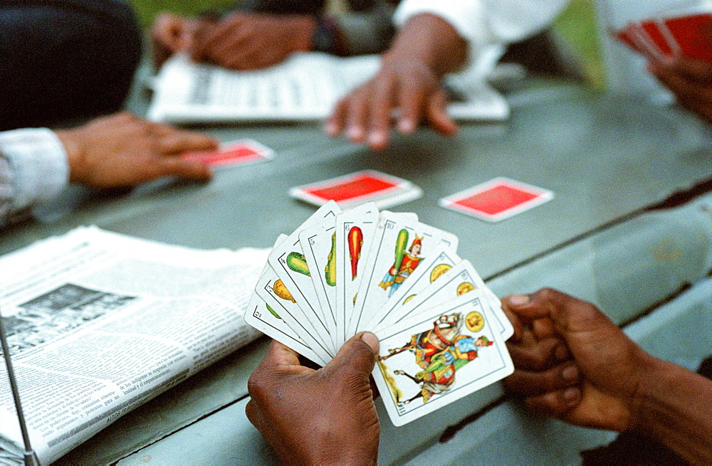 Men play cards in a Zapatista community in the state of Chiapas, Mexico.
