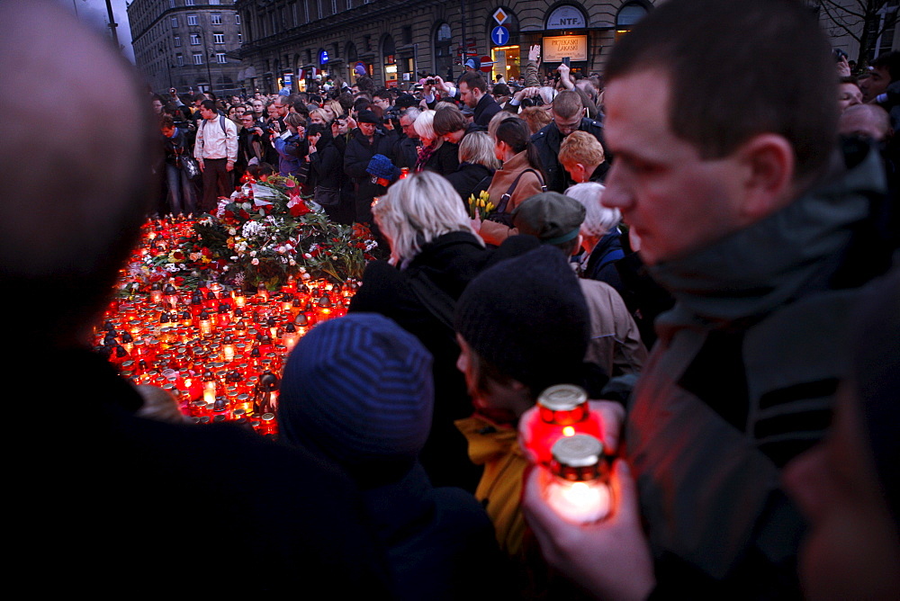 Mourners gather in Warsaw following the death in an airplane crash in Russia of the Polish president Lech Kaczynski, his wife and over ninety other high ranking government, military, civic and religious leaders.