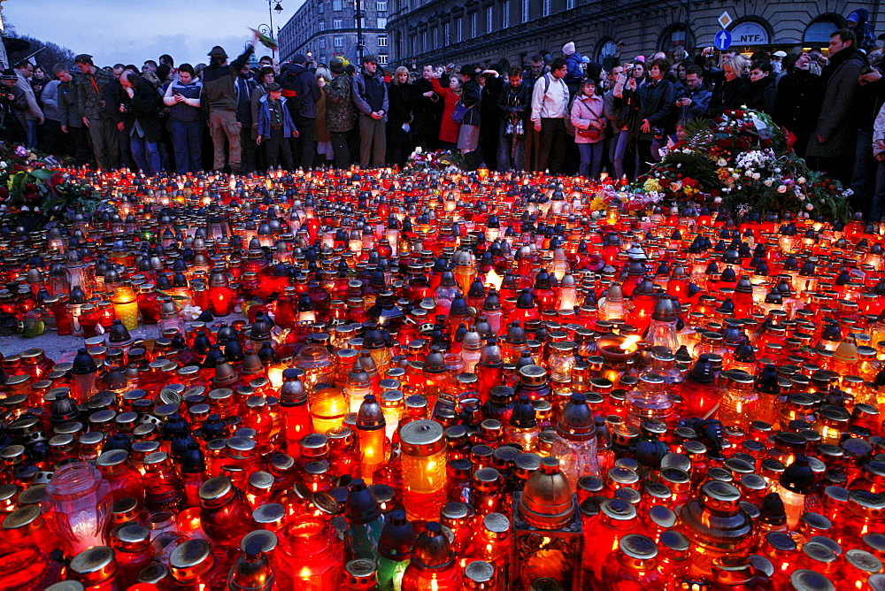 Mourners gather in Warsaw following the death in an airplane crash in Russia of the Polish president Lech Kaczynski, his wife and over ninety other high ranking government, military, civic and religious leaders.