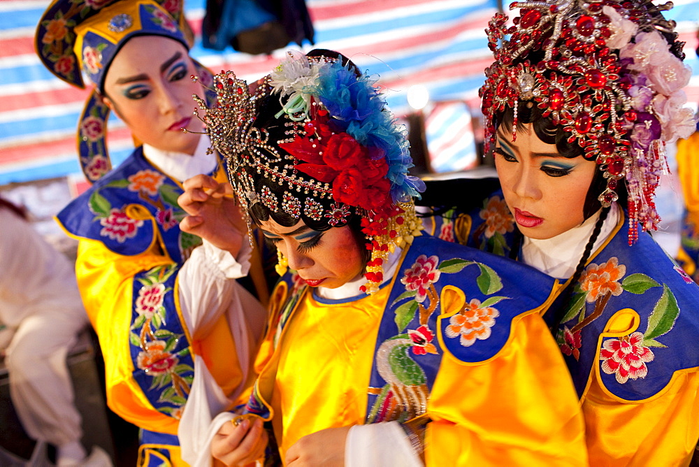 Chinese opera performers dress backstage before a show in Ximending, Taipei, Taiwan, November 8, 2010.