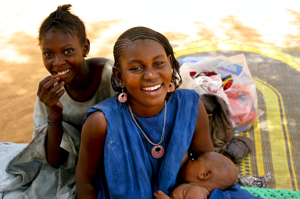 A young African Toureg mother nurses her newborn baby, Gossi, Mali, West Africa