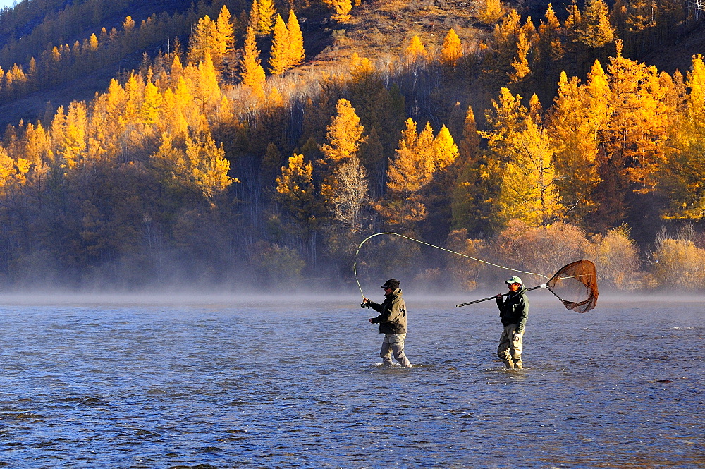 Angler and guide on the Eg River,  Mongolia