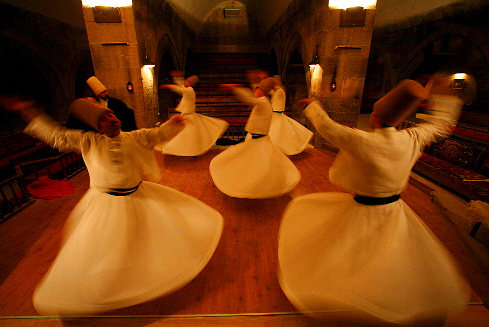 Whirling Dervishes: Men twirl in long whit robes as a part of a traditional Turkish Sema (ceremony).