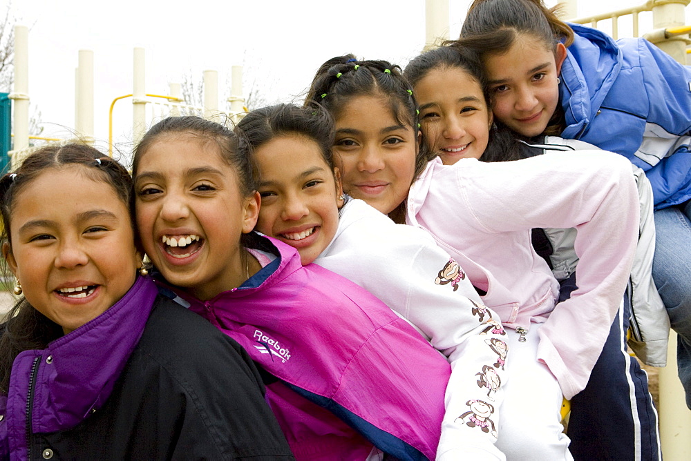 Palmira Gonzalez-Jiminez is surrounded by her best buddies in the playground at Harrington Elementary School in Denver, Colorado. A man tried to abduct Palmira in a nearby park last month. Her friends all ran to her aid hitting and kicking the man. The girls are L to R Irma Belmontes, Crystal Palacios, Melina Sandoval, Palmira Gonzalez-Jiminez,   Sandra Ibarra, Lorena Luna.