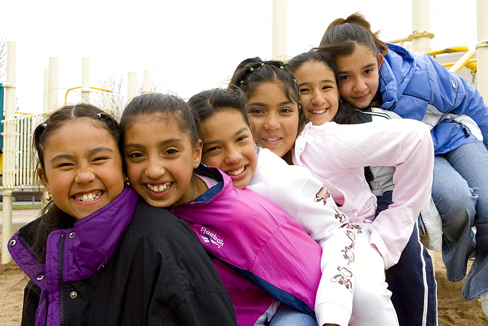 Palmira Gonzalez-Jiminez is surrounded by her best buddies in the playground at Harrington Elementary School in Denver, Colorado. A man tried to abduct Palmira in a nearby park last month. Her friends all ran to her aid hitting and kicking the man. The girls are L to R Irma Belmontes, Crystal Palacios, Melina Sandoval, Palmira Gonzalez-Jiminez,   Sandra Ibarra, Lorena Luna.