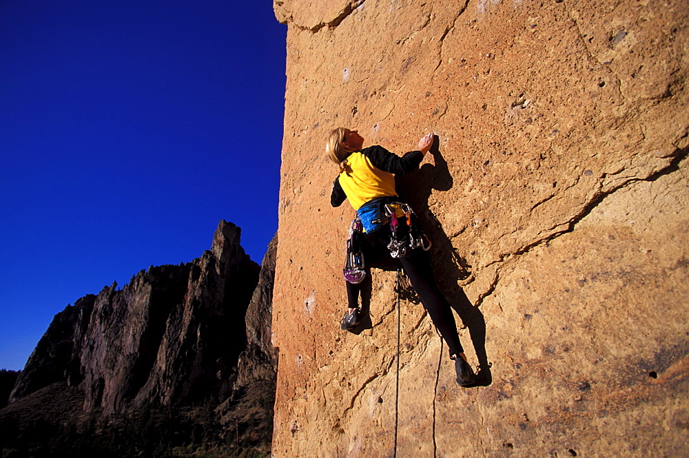 Nancy Prichard climbing Chain Reaction 5.12c at Smith Rock near Bend, Oregon.