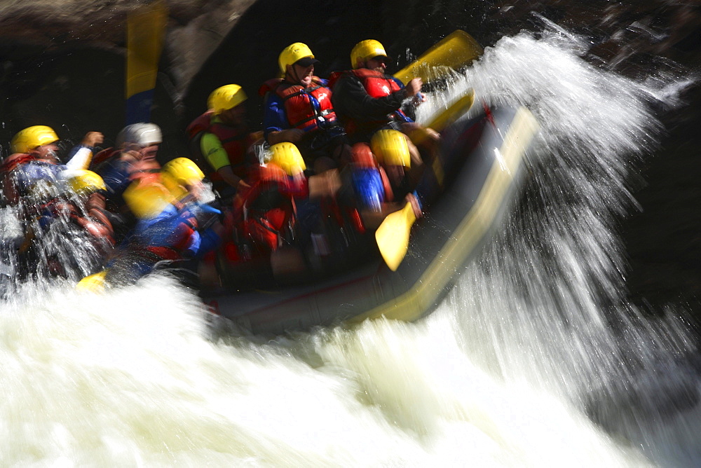 Motion-blur photo of unknown whitewater rafters crashing through Pillow Rock rapid on the Upper Gauley river near Fayetteville, WV