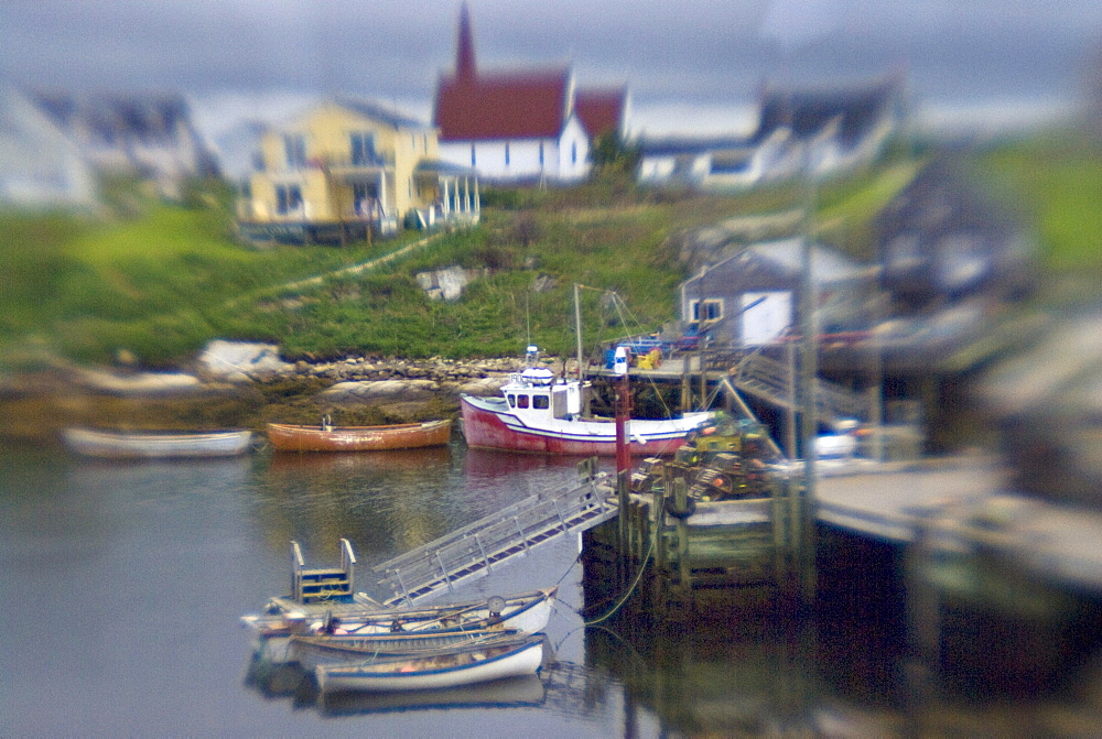 Peggy's Cove near Halifax Nova Scotia. This is an old fishing town. It is one of the closest points to where the Titanic sunk. Survivors were brought to Halifax about 30 miles from Peggy's Cove.When ocean cruise ships dock in Halifax Peggy's Cove is a day trip for some of the travelers before returning to the ship.  A lighthouse is perched on the edge of Peggy's Cove