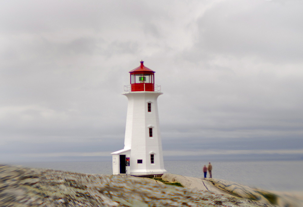 Peggy's Cove near Halifax Nova Scotia. This is an old fishing town. It is one of the closest points to where the Titanic sunk. Survivors were brought to Halifax about 30 miles from Peggy's Cove.When ocean cruise ships dock in Halifax Peggy's Cove is a day trip for some of the travelers before returning to the ship.  A lighthouse is perched on the edge of Peggy's Cove