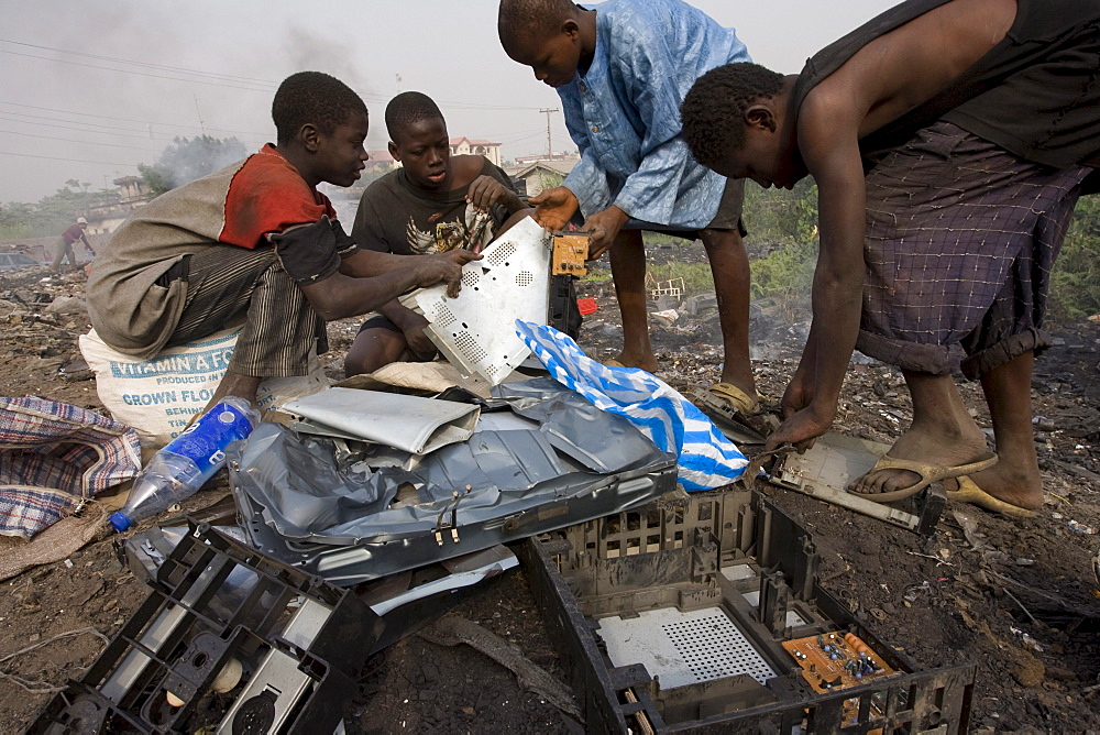 Alaba Market, Lagos Nigeria. Many of the computers here are second hand and shipped from Asia, the USA or Europe for reuse. The small shop dealers buy electronics from the containers and are very good at repairing the goods for sale. Only when material has no value is it sent to nearby dumps. Some kids look through this and try to salvage some coppers wires or aluminum pieces.