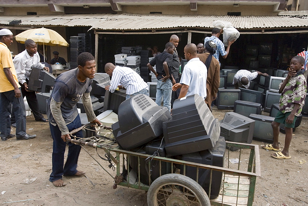 Alaba Market, Lagos Nigeria. Many of the computers here are second hand and shipped from Asia, the USA or Europe for reuse. The small shop dealers buy electronics from the containers and are very good at repairing the goods for sale. When material has no value is it sent to nearby dumps, and young men look for parts or wire that they recycle the metals. However, much toxic material ends up in these dumps in Nigeria.