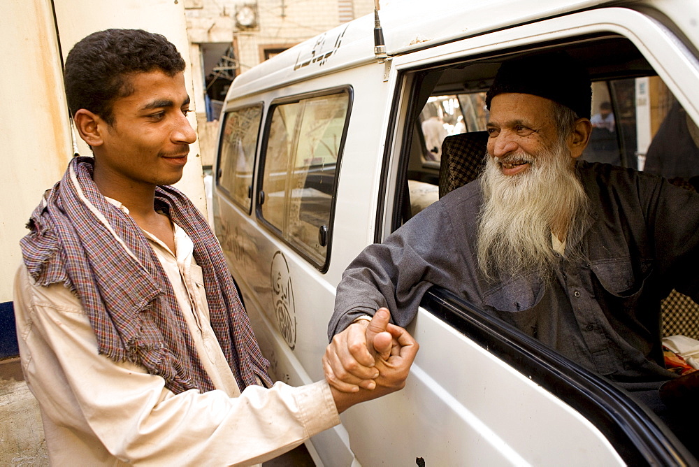 Pakistani do gooder Abdul Sattar Edhi greets a well wisher on February 1, 2008.