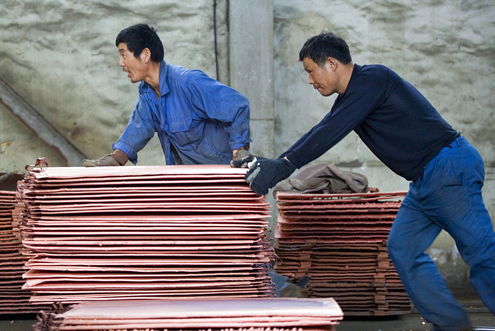 Chinese workers labor at a copper smelter in Tongling in China's central Anhui Province. The smelter refined some of the metals that will be used in the 2008 Summer Olympic medals to be held in Beijing.