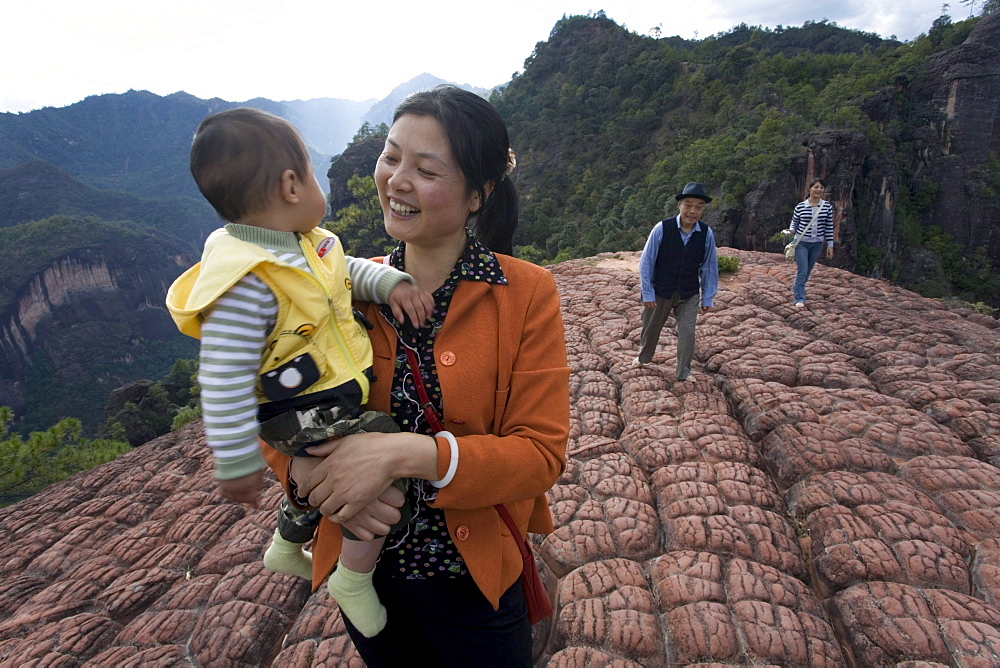 Chinese tourists at the top of Thousand Turtle Mountain in the Laojun Mountain Nature Reserve north of Lijiang, Yunnan Province, China.