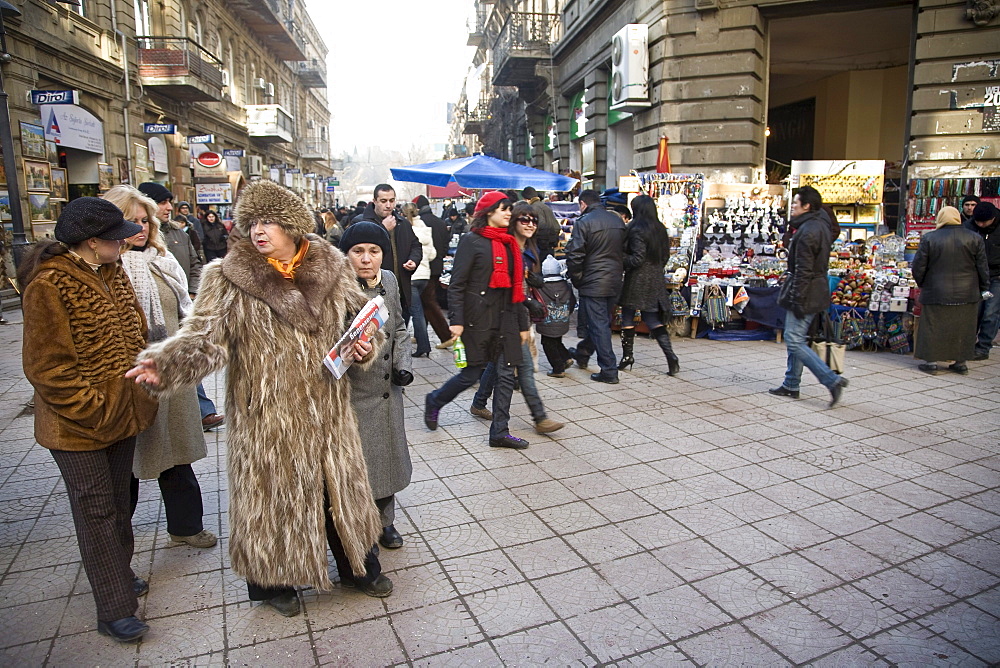 Baku, Azerbaijan - February 2008: Woman in fur coat shopping in the busy shopping street in the oil rich city of  Baku, Azerbaijan.