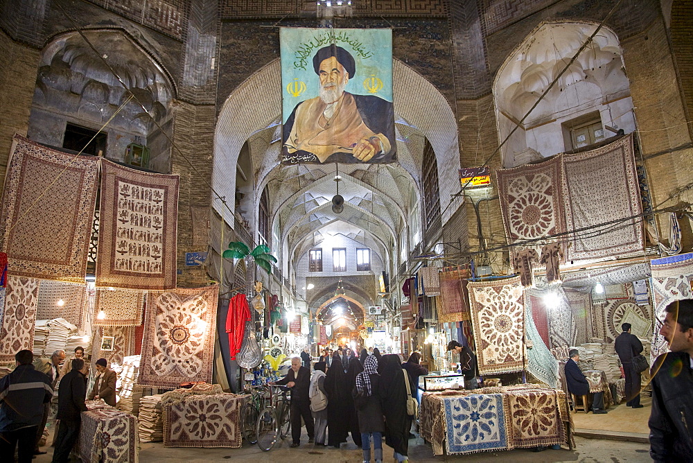 Esfahan, Iran - February, 2008: Portrait of the Ayatolloah Khomeini in Bazar-e Bozorg (Great Bazaar), a massive covered bazaar off of Imam Square in Esfahan, Iran  which dates back almost 1300 years.