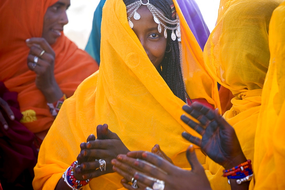 Shanabla woman sings at a wedding celebration near El Obeid, Sudan. A nomadic tribe they raise camels.