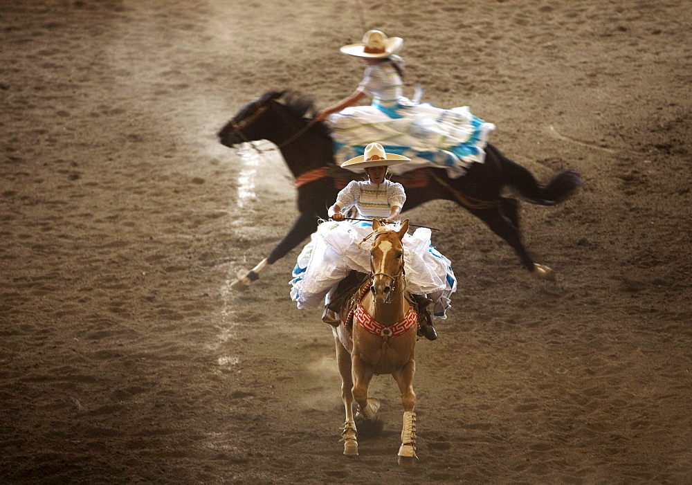 Amazonas at an Escaramuza competition in Mexico City, May 24, 2008. Escaramuzas are similar to US rodeos, where female competitors called "Amazonas" wear long skirts, and ride side saddle. Male rodeo competitors are "Charros," from which comes the word "Charreria." Charreria is Mexico's national sport.