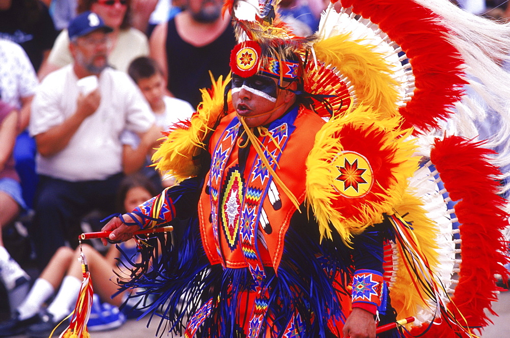 Indian fancy dancers display flashes of brilliant color as they compete in a native American dance contest during the Rattlesnake Festival in Apache, Oklahoma.