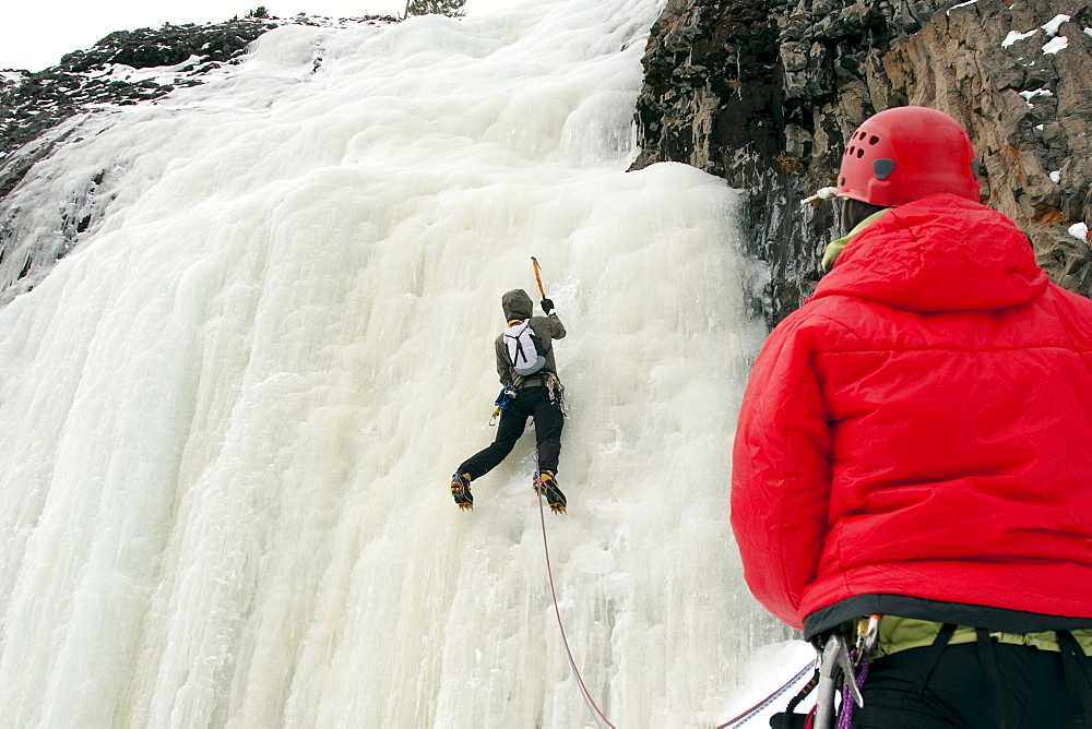 A man ice climbing.