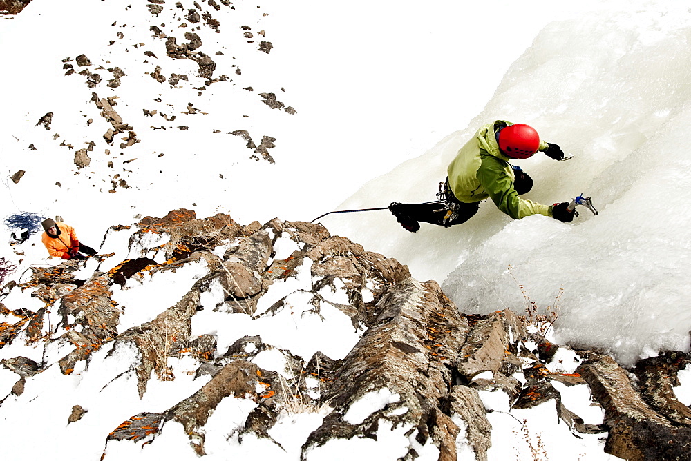 A man ice climbing.