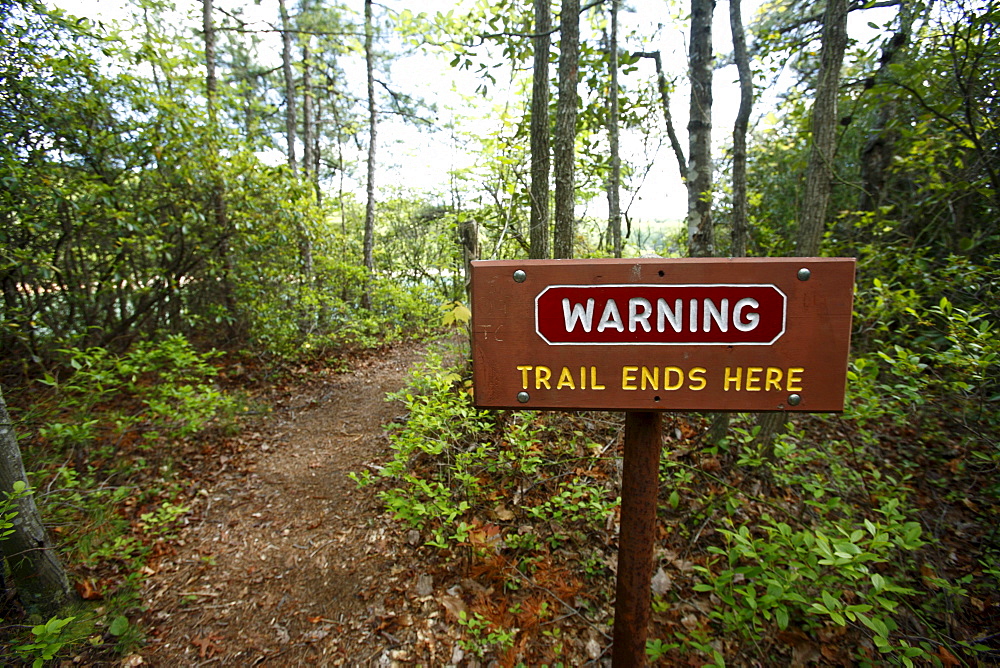 Trail warning sign reading