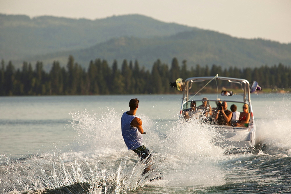 Young man wakeboarding in Idaho.