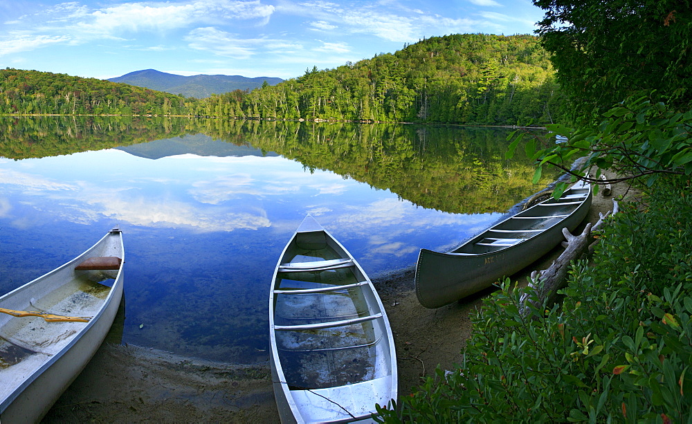 Swamped canoes on Heart Lake, Adirondack Park, NY, USA