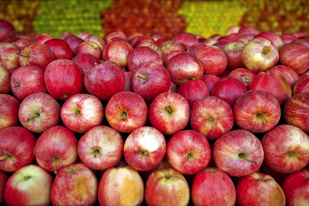 Red apples lay in a pile at a fruit stand in Maryland, USA.