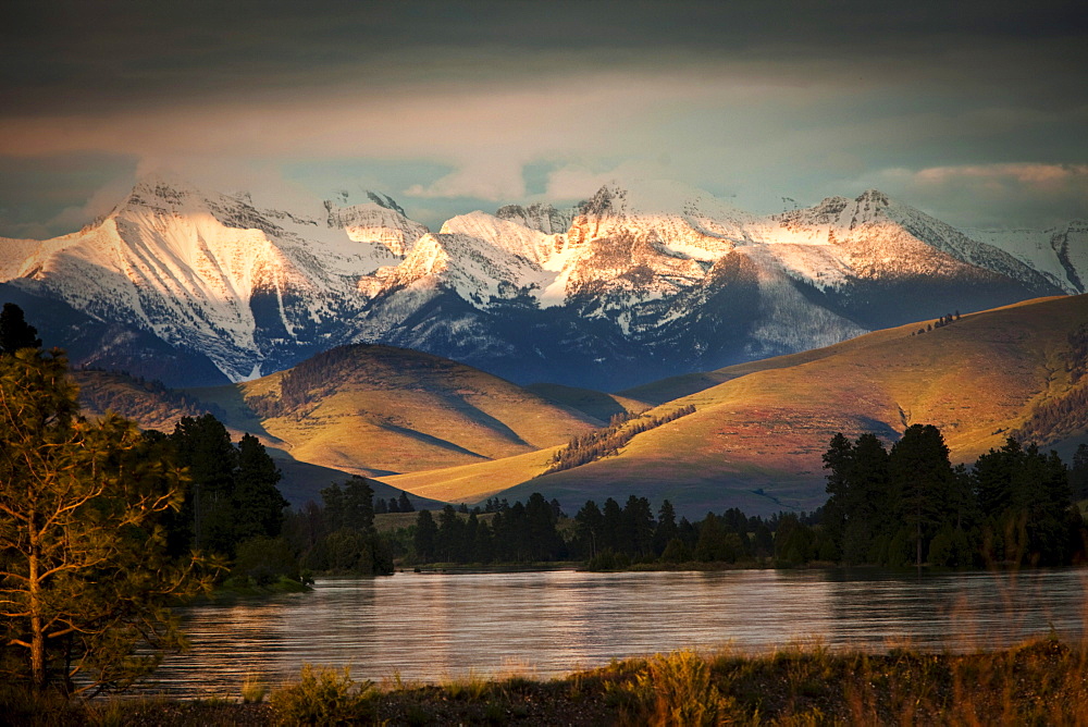 A beautiful river and mountain range at sunset in Montana.