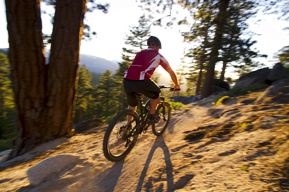 Jake Dore mountain biking on the Corral Trail in Lake Tahoe, California.