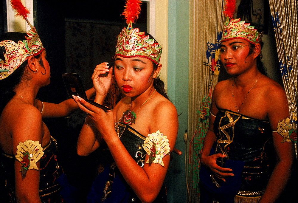 Javanese young women prepare for dance performance in Paramaribo, Suriname.