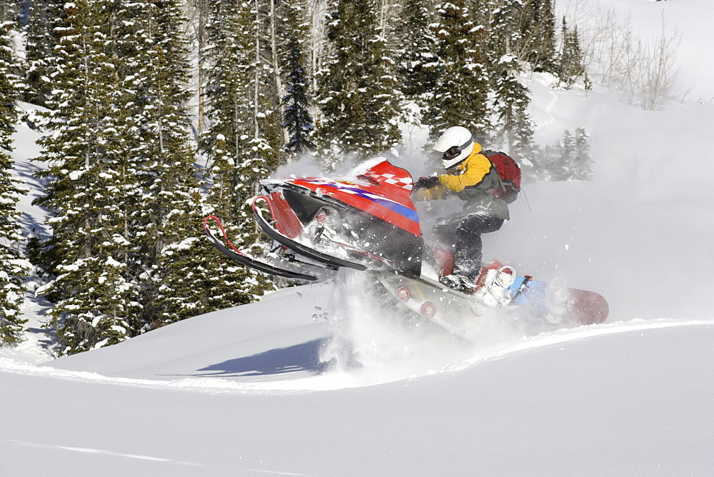 Snowmobiling in the mountains.