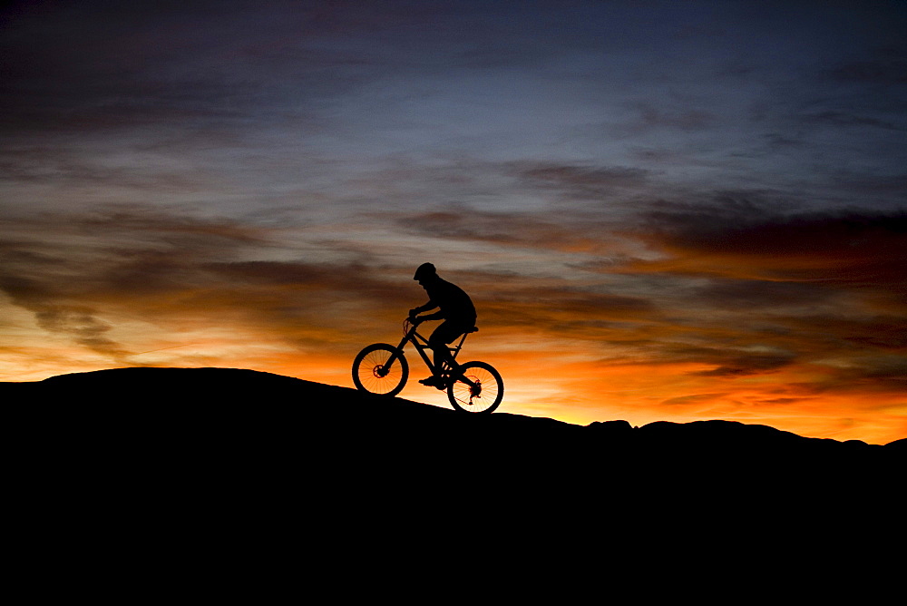 mountain biker at sunset, Moab, Utah