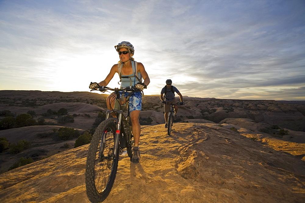 couple mountain biking, Moab, Utah