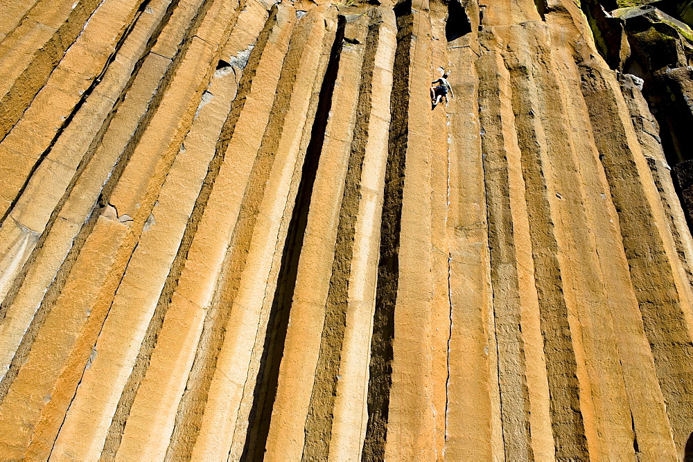 A mid adult man rock climbing at Trout Creek, Oregon.