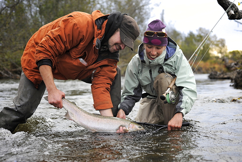 Fishermen with wild steelhead fished on Deep Creek on the Western Kenai Peninsula, Alaska September 2009.  Flowing into Cook Inlet north of Homer, the waters of Deep Creek and the Anchor River host late fall runs of wild steelhead.