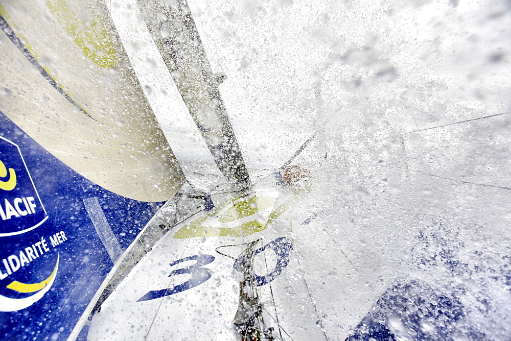 Onboard the IMOCA Open 60 Macif crewed by Francois Gabart and Michel Desjoyeaux during a training session before the Transat Jacques Vabre in the English Channel from Plymouth to Port la Foret after she won on her class the Rolex Fastnet Race.