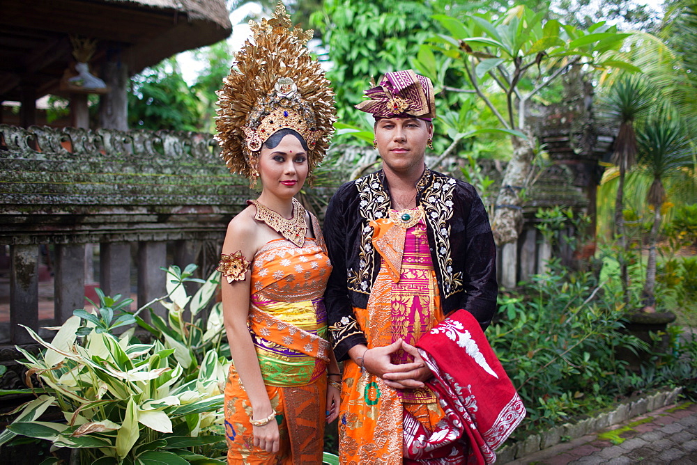 Couple enacting wedding scene in preparation for religious ceremony.Bali. Indonesia, Ubud, Bali Island, Indonesia