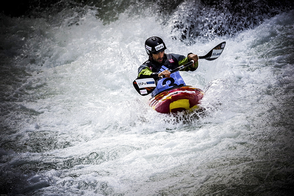 Kayaker Hannes Aigner (GER) is riding the Ötztaler Ache-River during the Adidas Sickline Extreme Kayaking World Championship 2014 in Oetz, Austria.