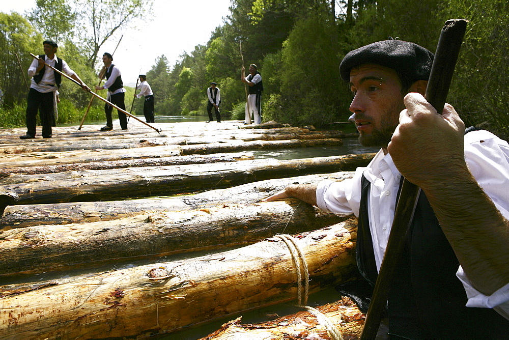 A ganchero was a person dedicated to a craft of assisting in the transport of a large quantity of loose logs floating downstream. by the river Tagus.