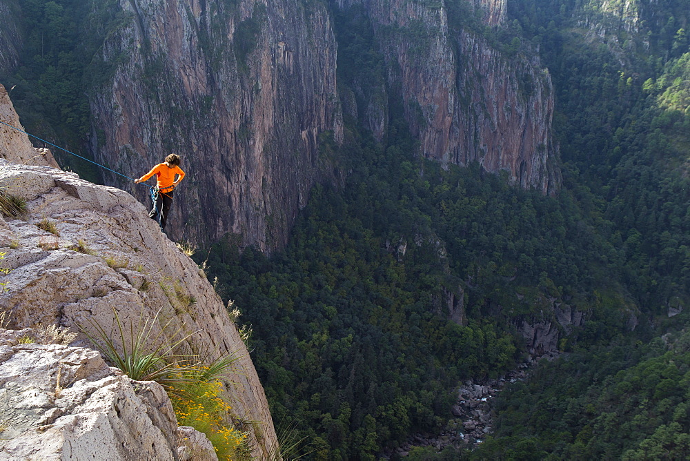 A man checks out the climbing routes at the top of Basaseachic waterfalls in Chihuahua, Mexico