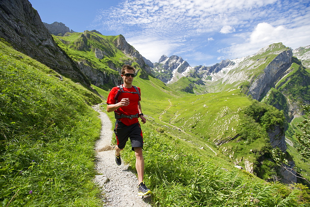 Romain Burgat-Charuillon hiking in the mountains of Appenzellerland, Switzerland.