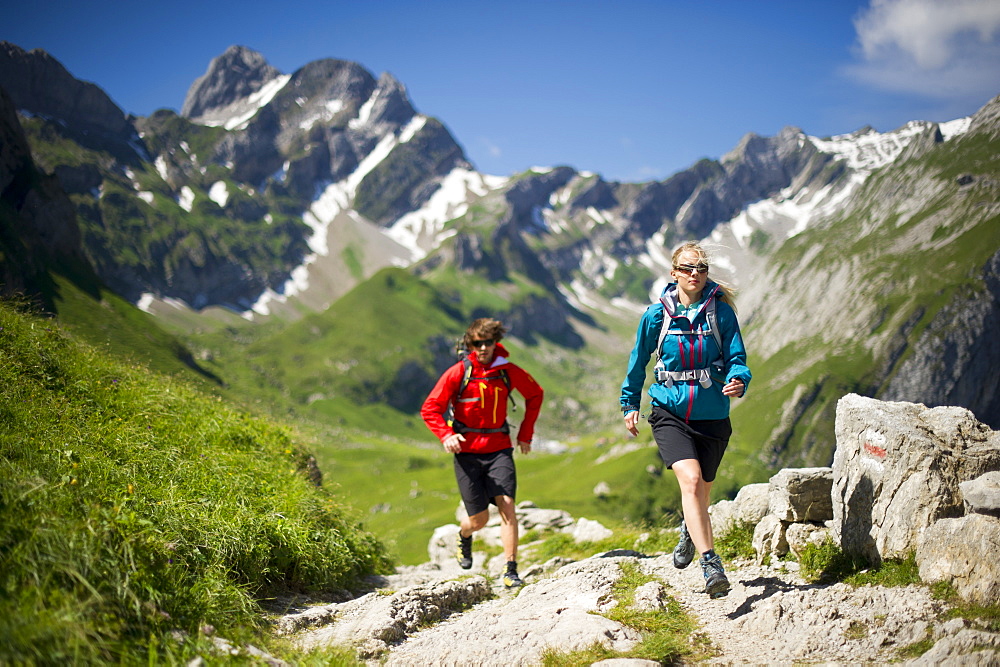 Regina Kinzner and Jochen Reiser hiking in the mountains of Appenzellerland, Switzerland.