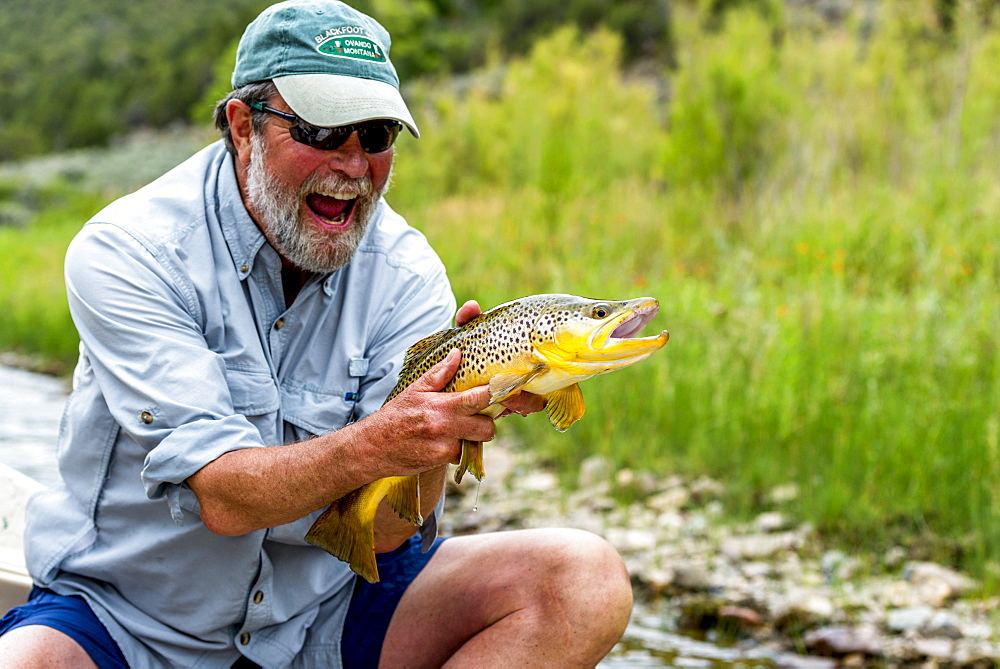 A man with a 21 inch Brown on the Green River